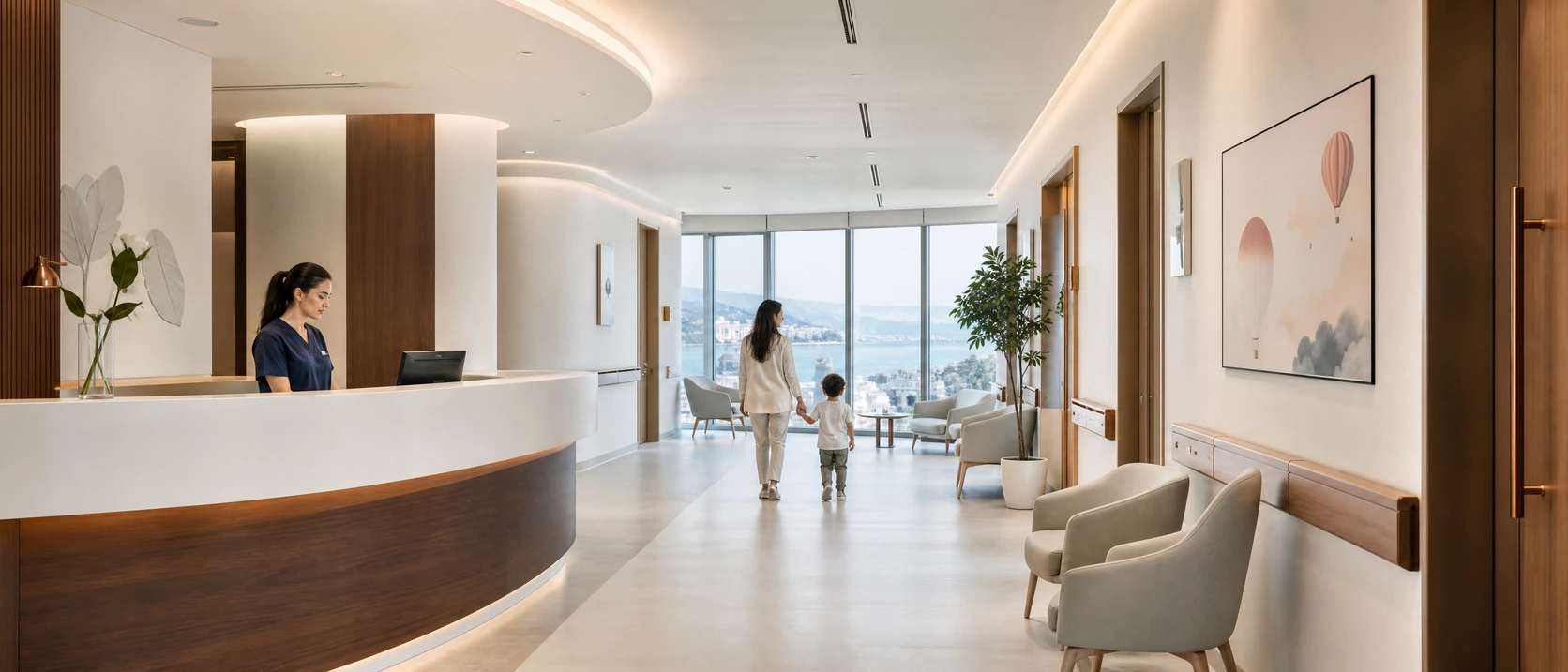 Pediatric wing of the partner hospital in Istanbul: a nurse station in warm walnut, and a parent walking hand in hand with a child toward tall windows.